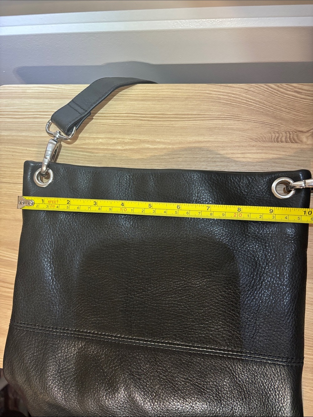 Black Leather Crossbody Bag with Silver Ring Details - Picture 13 of 15
